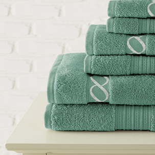 jewel tone embroidered rug jade